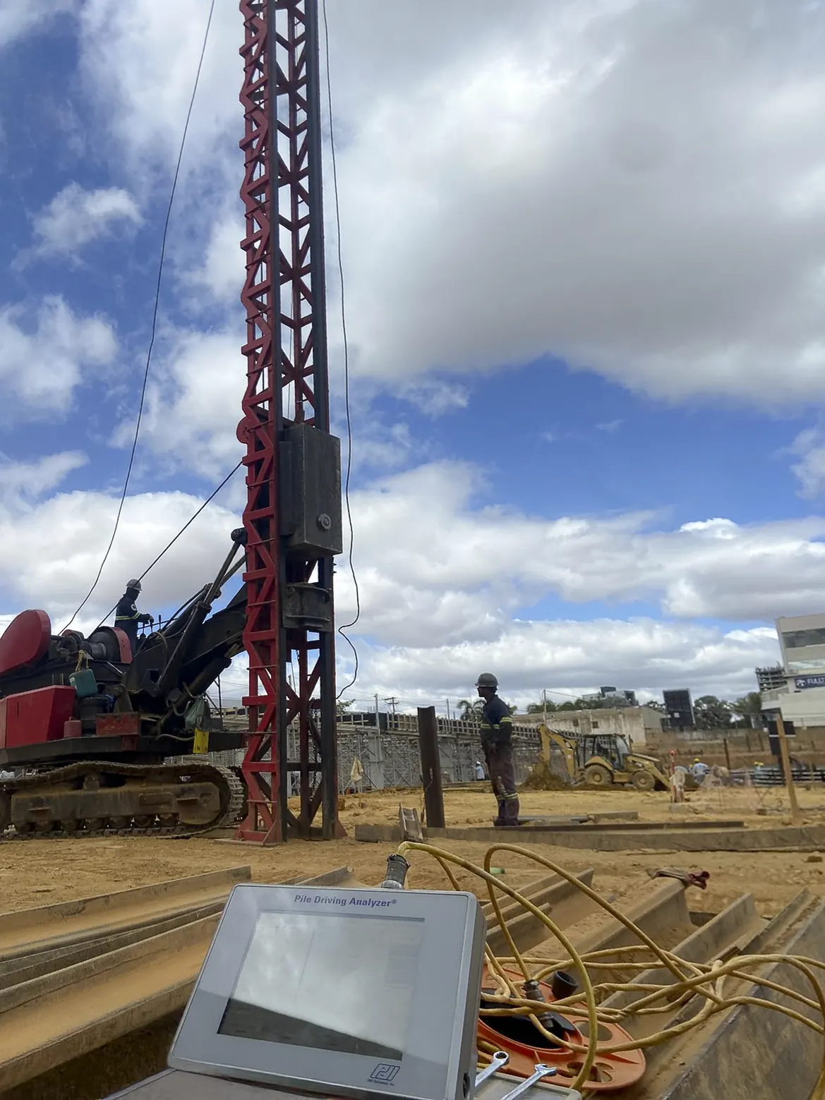 PDA testing being performed with a pile driver and Geoteste sensors positioned on the pile.